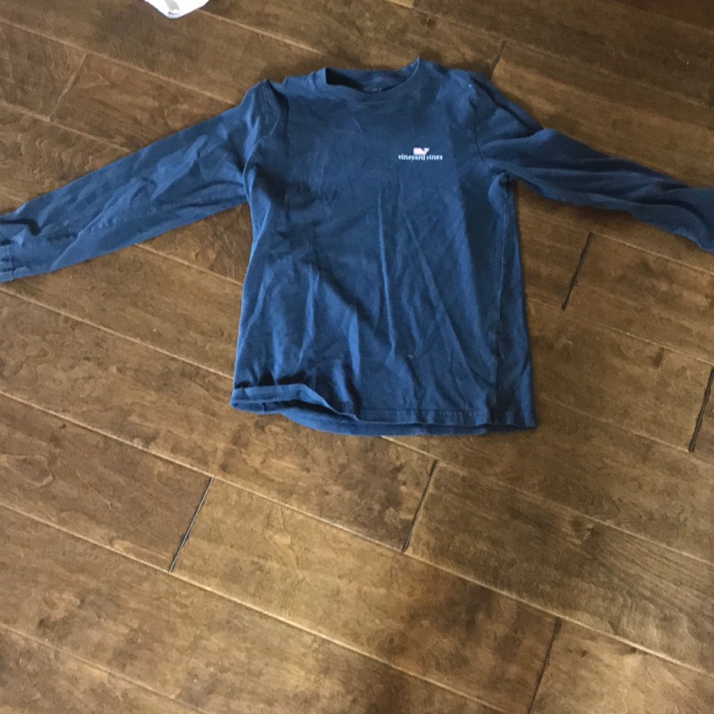 A bundle of a sweater and log sleeves shirt